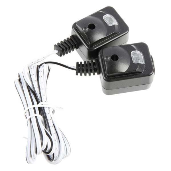 Garage door safety sensor kit showing mounting brackets and installation components. Garage door safety sensor kit showing mounting brackets and installation components.