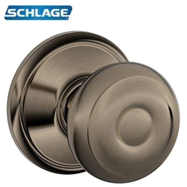 Schlage Georgian Passage Door Knob in Antique Pewter finish (F10-GEO-620), displayed against a white background