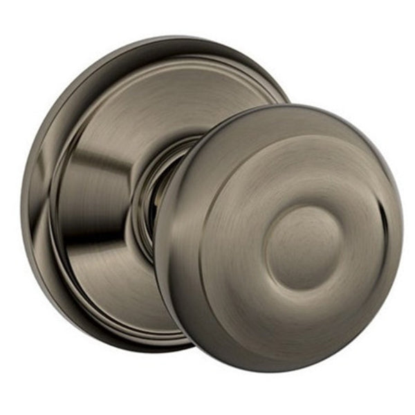 Close-up of the Schlage Georgian-style non-locking passage door knob, highlighting its Antique Pewter finish and classic design.